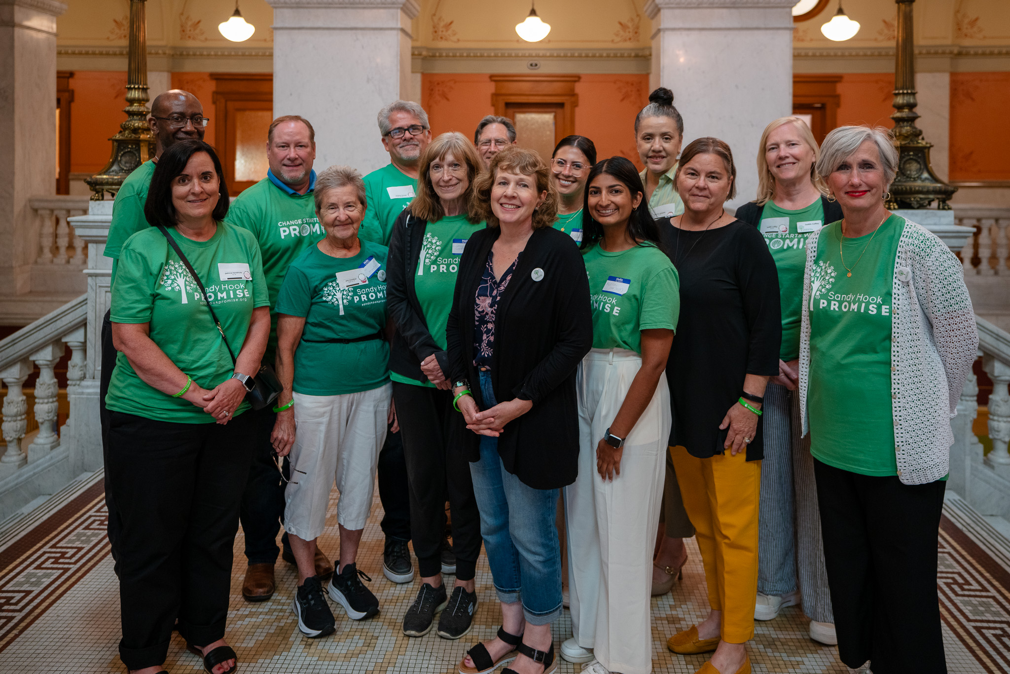 Group of community and faculty members standing together smiling