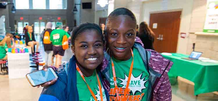 Two children standing together smiling